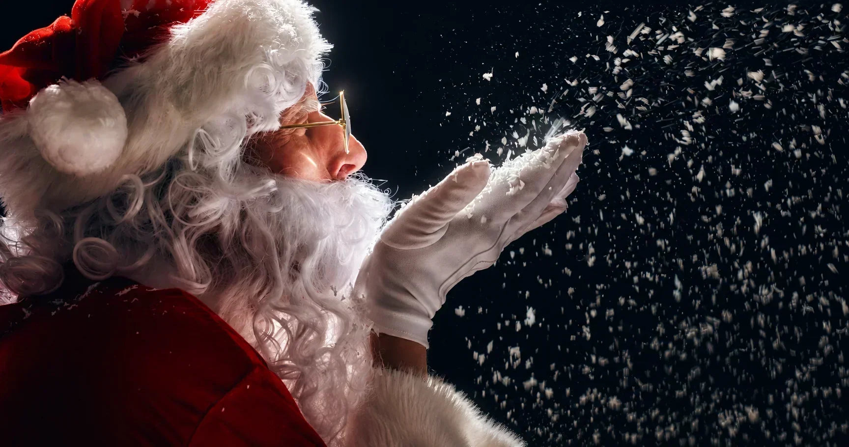 Santa Claus blowing snow