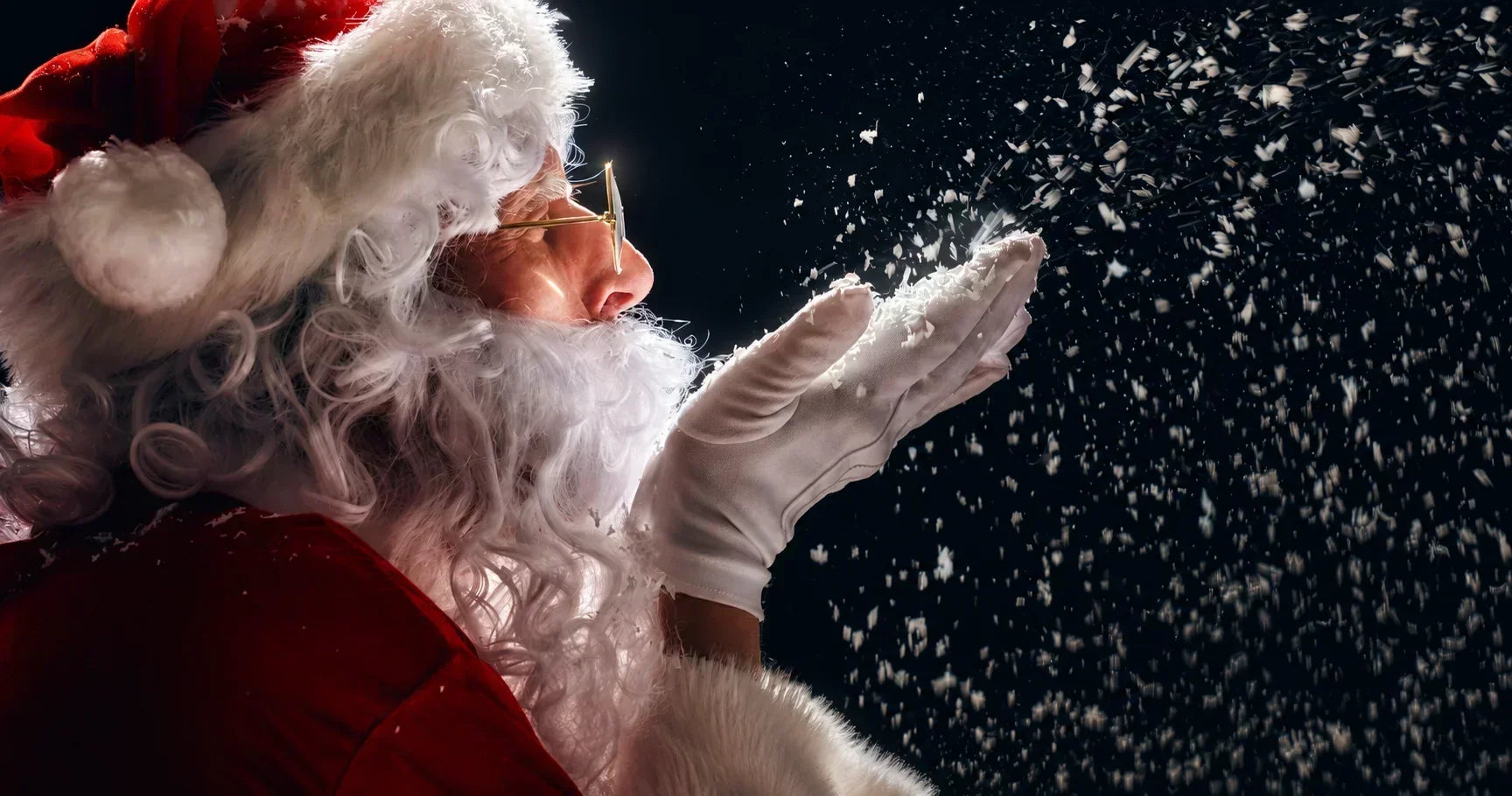 Santa Claus blowing snow